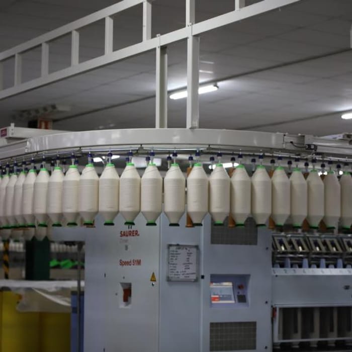 Industrial circular knitting machinery producing jersey fabric